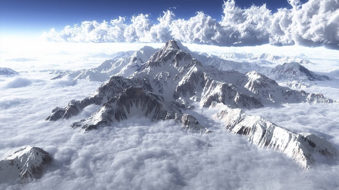 Snow-capped mountains above the clouds