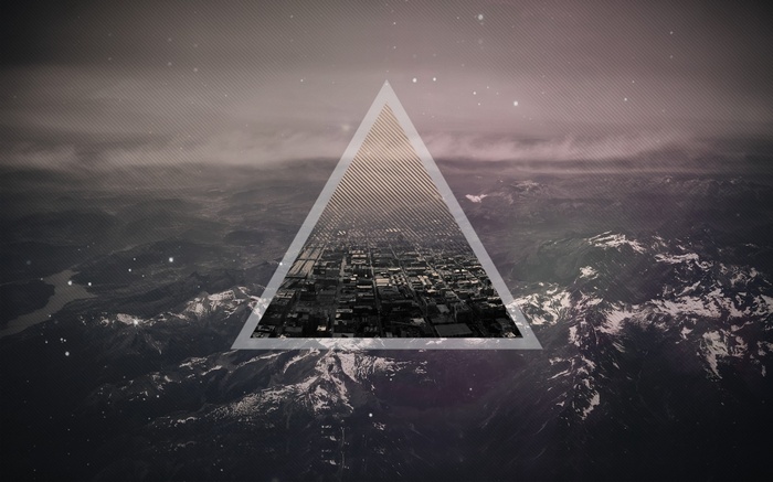 Digital art with a triangle overlaying a city and mountains