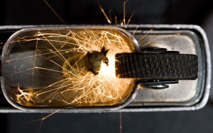 Close-up of a Zippo lighter sparking