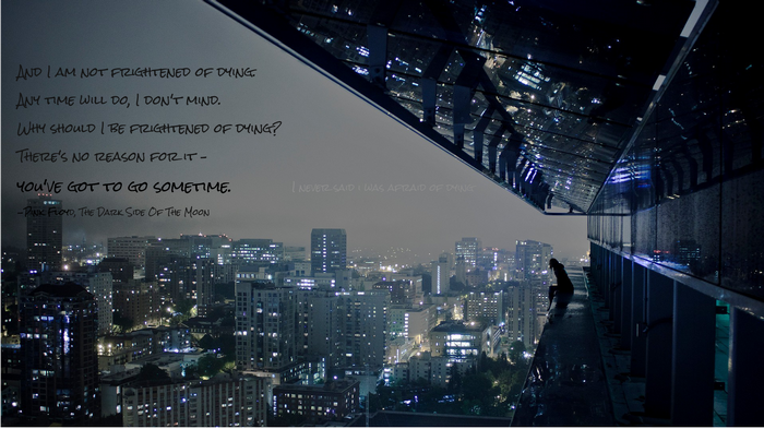 Pink Floyd quote over a city at night
