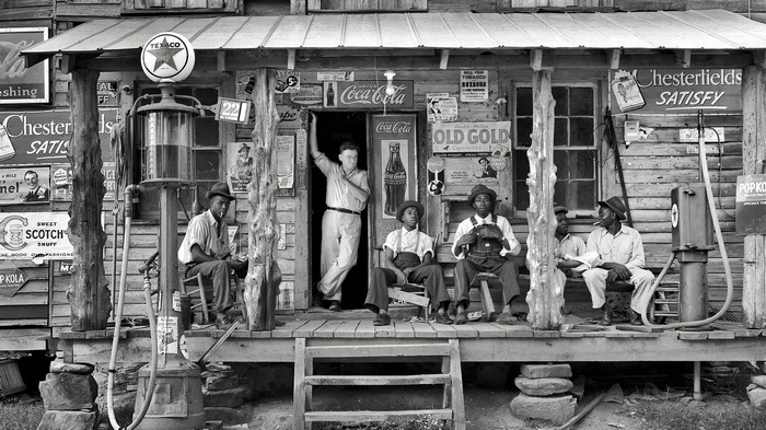 Vintage Coca-Cola store with men on the porch
