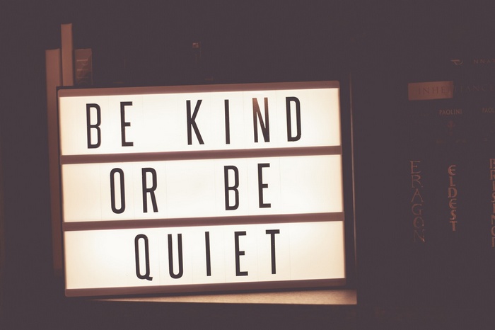 Lightbox sign with "BE KIND OR BE QUIET"