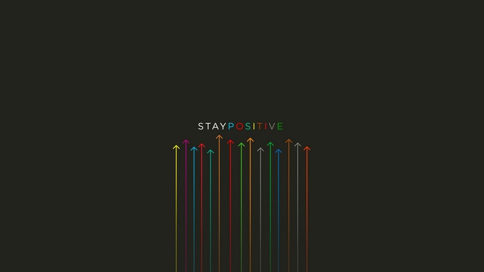 Motivational typography with colorful arrows pointing upwards