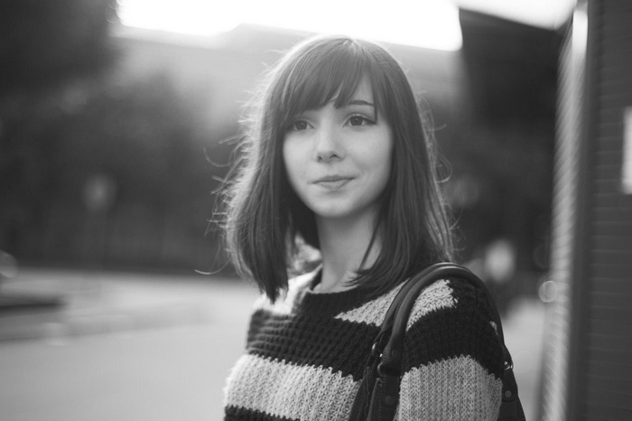 Katya Lischina wearing a striped sweater