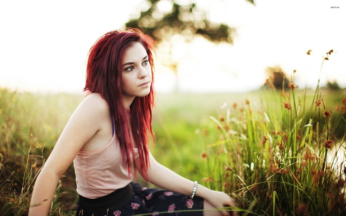 Tosha McCarter sitting in a field