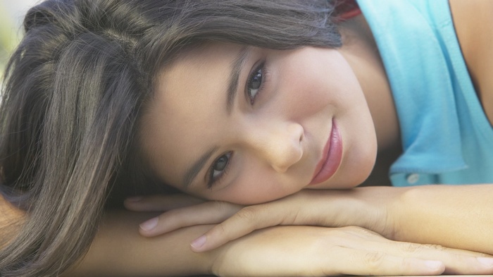 Young woman with dark hair smiling