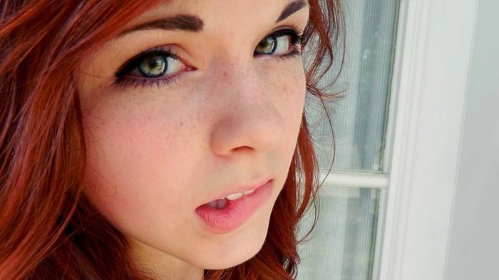Claire Monnier, redhead woman biting lip