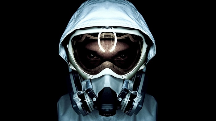 Person wearing a gas mask and hood
