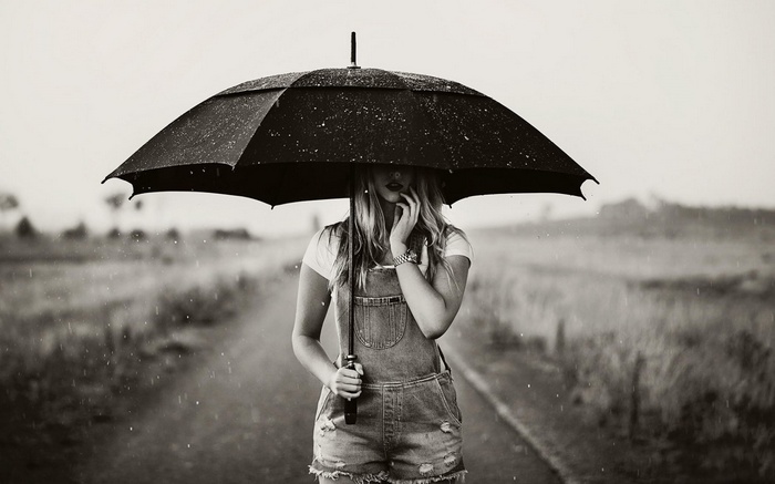 Woman holding an umbrella in the rain