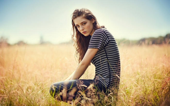 Birdy in a striped shirt in a field