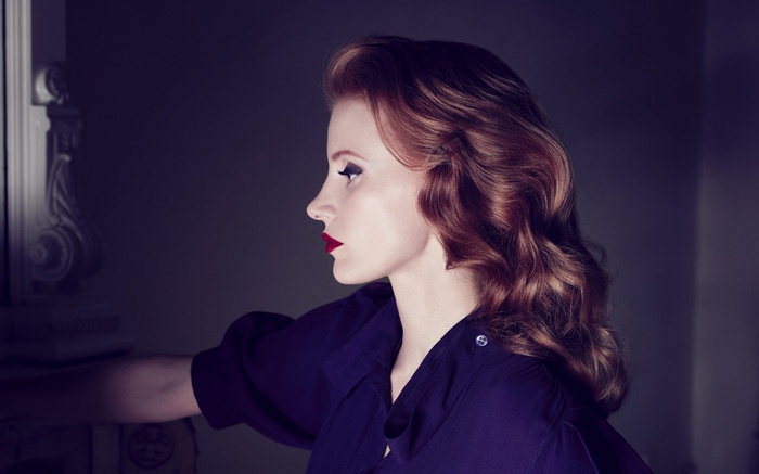 Jessica Chastain in profile with red lipstick