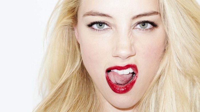 Amber Heard with tongue out and red lipstick