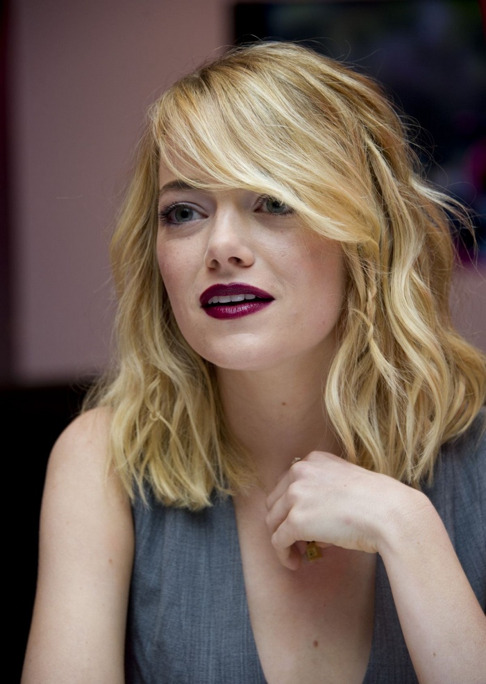 Emma Stone with blonde wavy hair