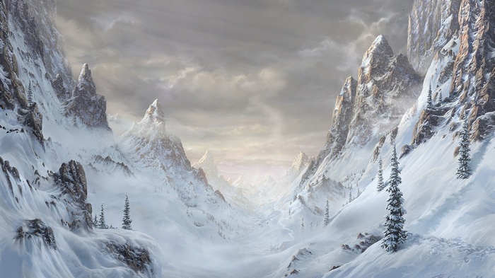 Snowy mountain valley with sharp peaks and cloudy sky