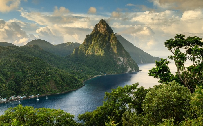 The Pitons mountains in Saint Lucia with a bay and village