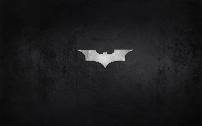 The Batman logo on a dark background