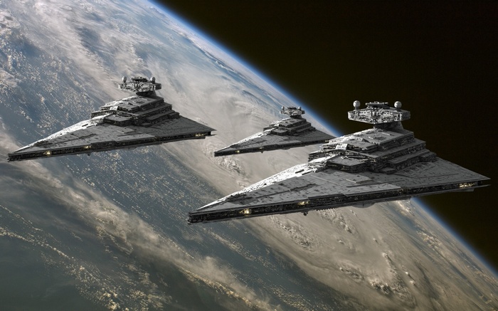 Star Wars Star Destroyers orbiting a planet
