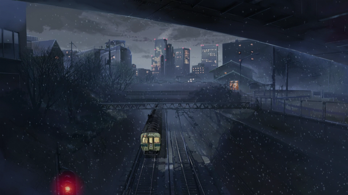 Anime train in a snowy cityscape at night