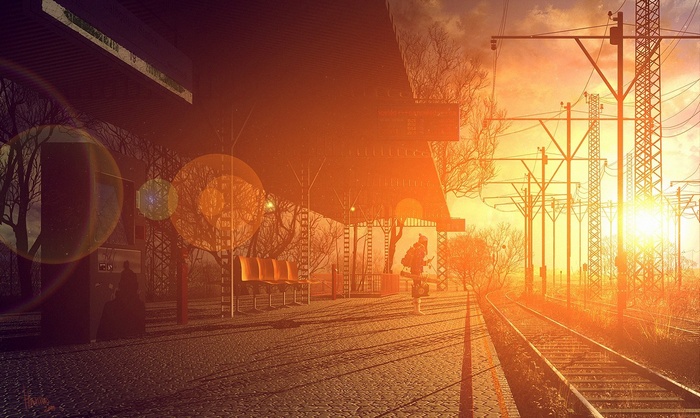 Train station at sunset with power lines and lens flare