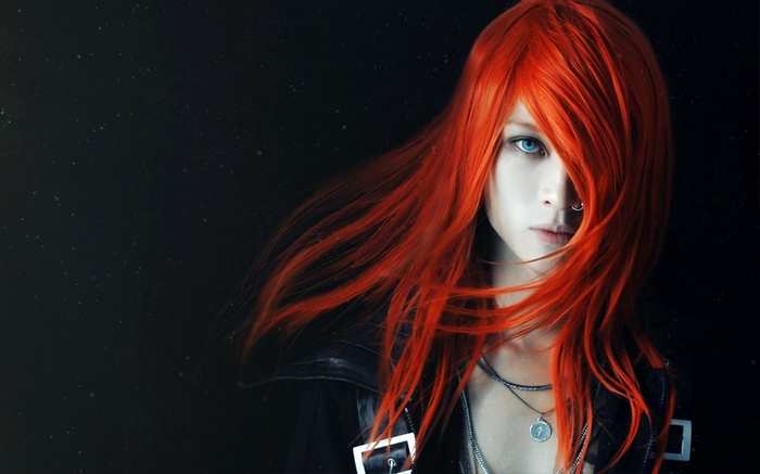 Redhead woman with blue eyes and nose piercing