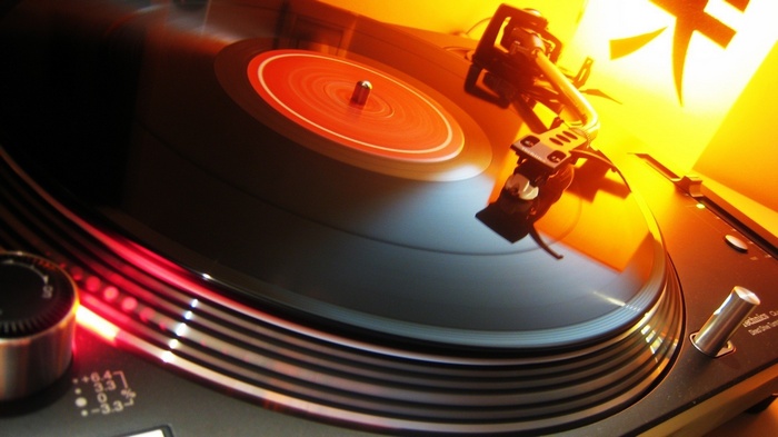 Technics DJ turntable playing a vinyl record