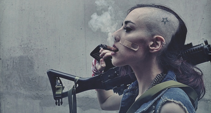 Tank Girl with a gun smoking a cigar