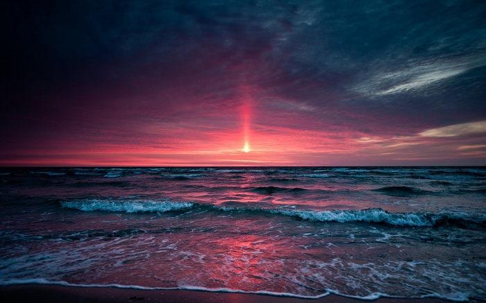 Sunset over the sea with dramatic clouds