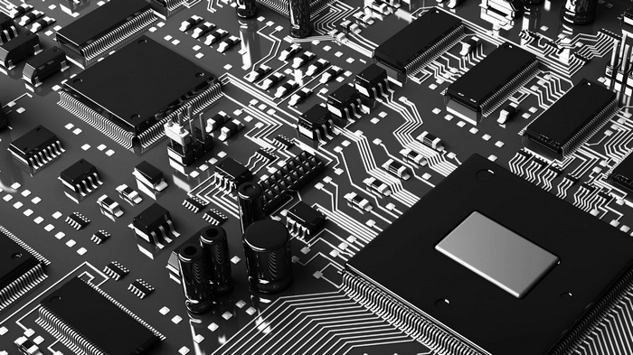 Monochrome close-up of a computer motherboard with chips