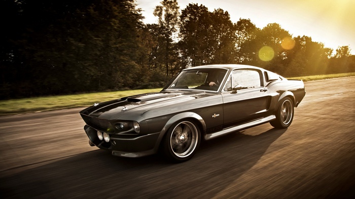 1967 Ford Mustang Shelby GT500 driving on a road