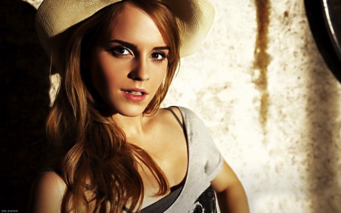 Emma Watson wearing a hat and looking at the viewer