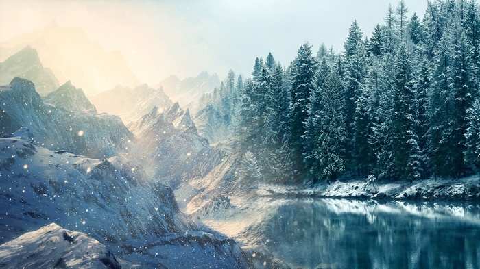 Snowy mountains and a lake with pine trees