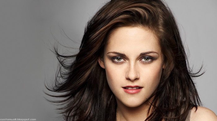 Portrait of Kristen Stewart with brunette hair and green eyes