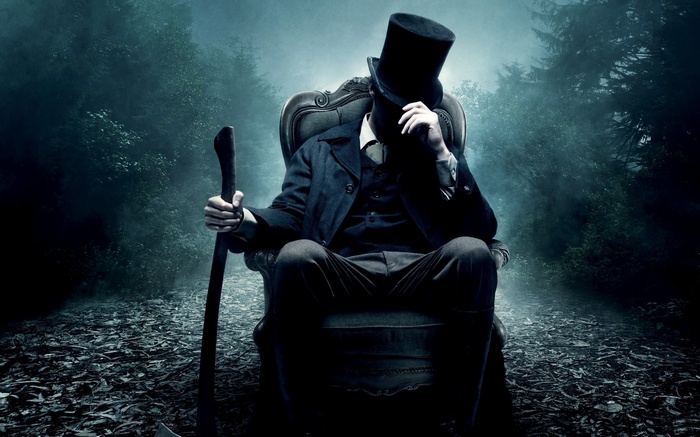 Abraham Lincoln: Vampire Hunter sitting with axe