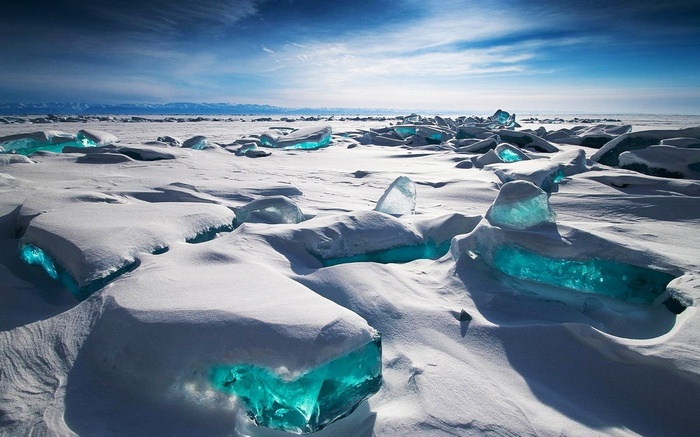 Blue ice formations on snowy Lake Baikal, Siberia