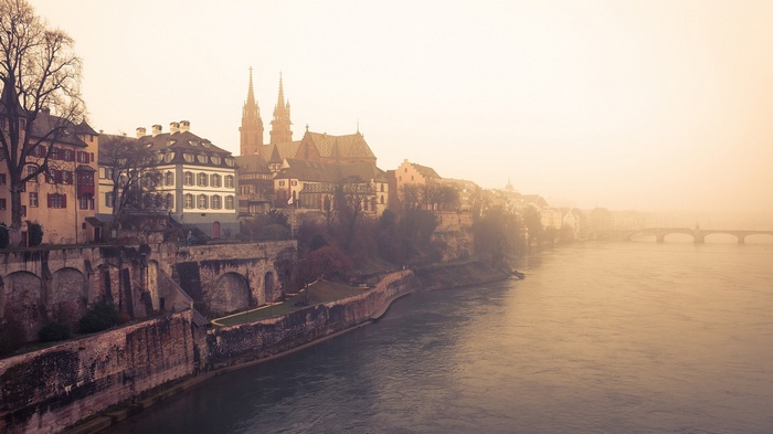 Basel cityscape with river and bridge in mist