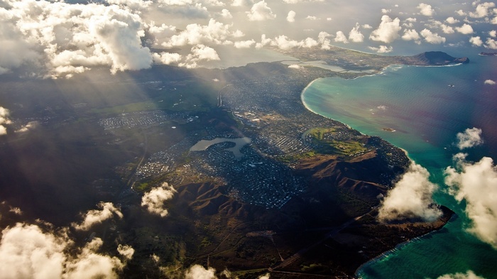 Aerial view of Oahu, Hawaii coastline with clouds
