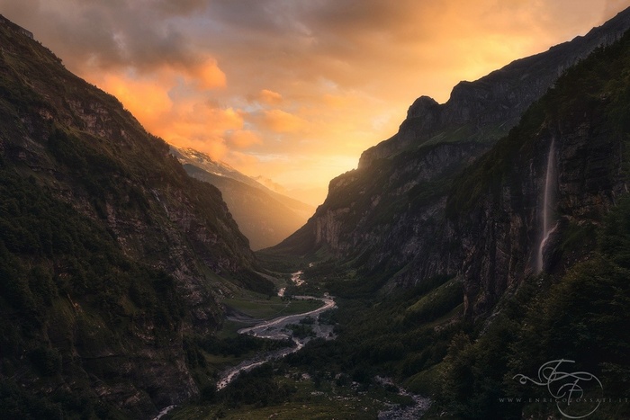 Majestic mountain valley at sunset with a river