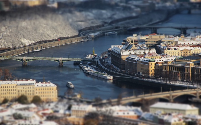 Prague cityscape with river and bridges in winter