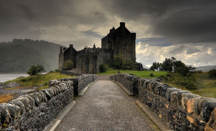 Eilean Donan Castle in Scotland under overcast skies