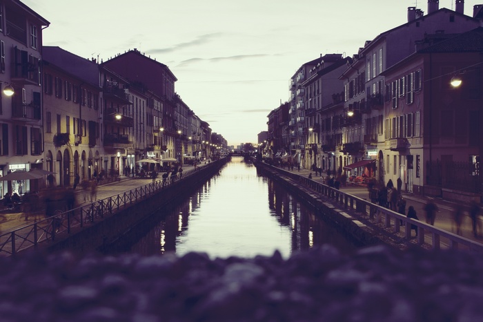 Cityscape at dusk with a canal and buildings