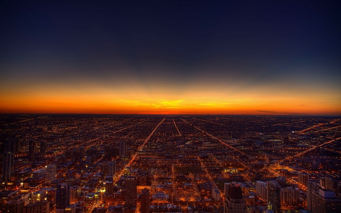 Chicago cityscape at sunset with glowing lights
