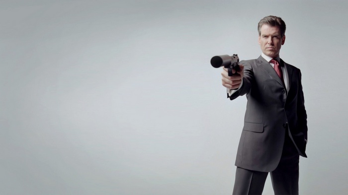 Pierce Brosnan as James Bond holding a gun