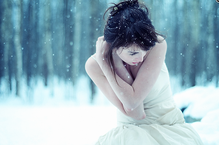 Woman in white dress in the snow