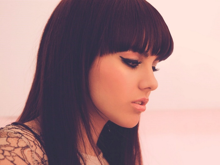 Ewa Farna with long dark hair and bangs