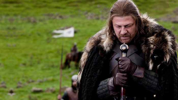 Ned Stark holding a sword in Game of Thrones