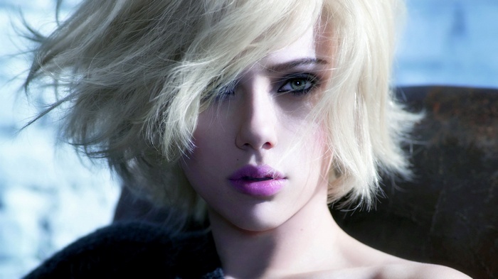 Scarlett Johansson with blonde hair and purple lipstick