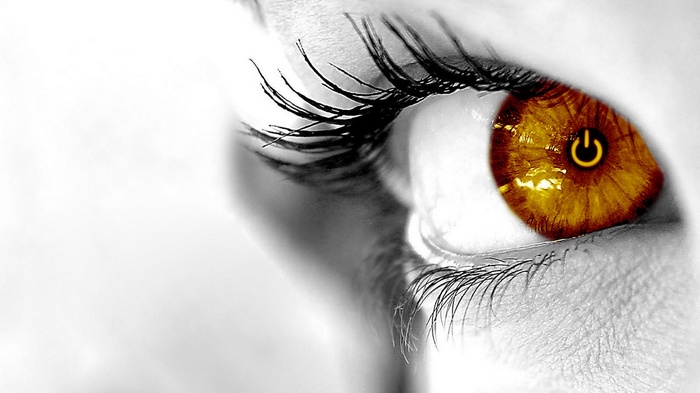 Close-up of a woman's eye with a power symbol