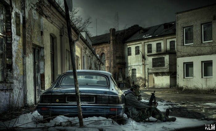 S.T.A.L.K.E.R. character with gas mask and rifle in abandoned Poland