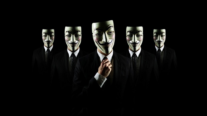 Group of people wearing Anonymous Guy Fawkes masks