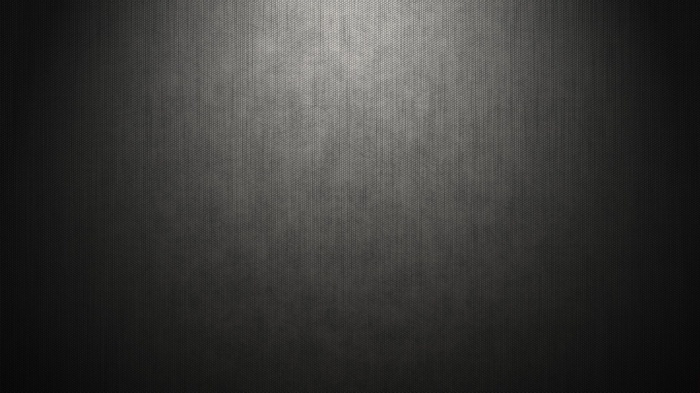 Dark textured surface with light gradient